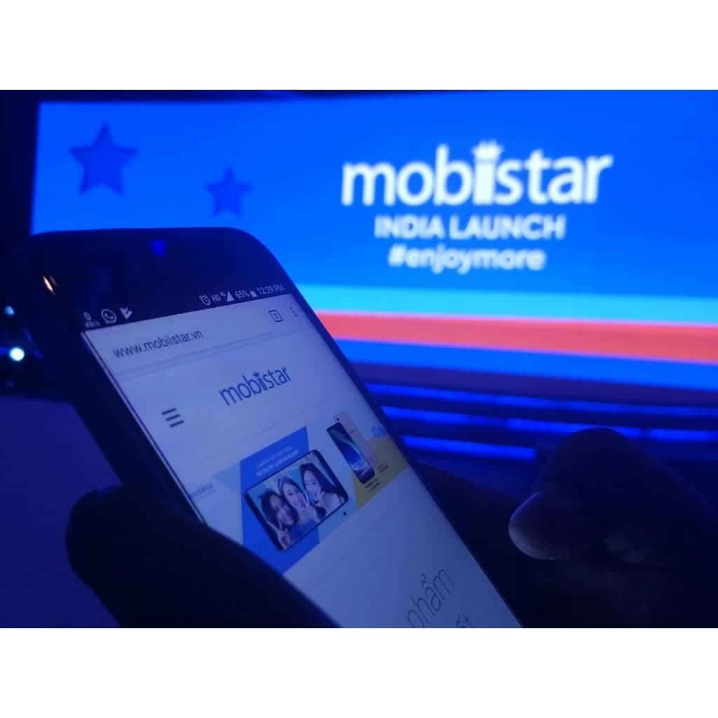 Mobiistar media launch event screen with a presenter